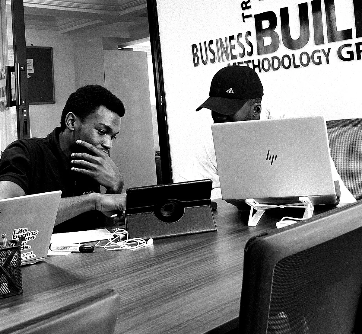 Darryl Wassi focused at his computer, in the office