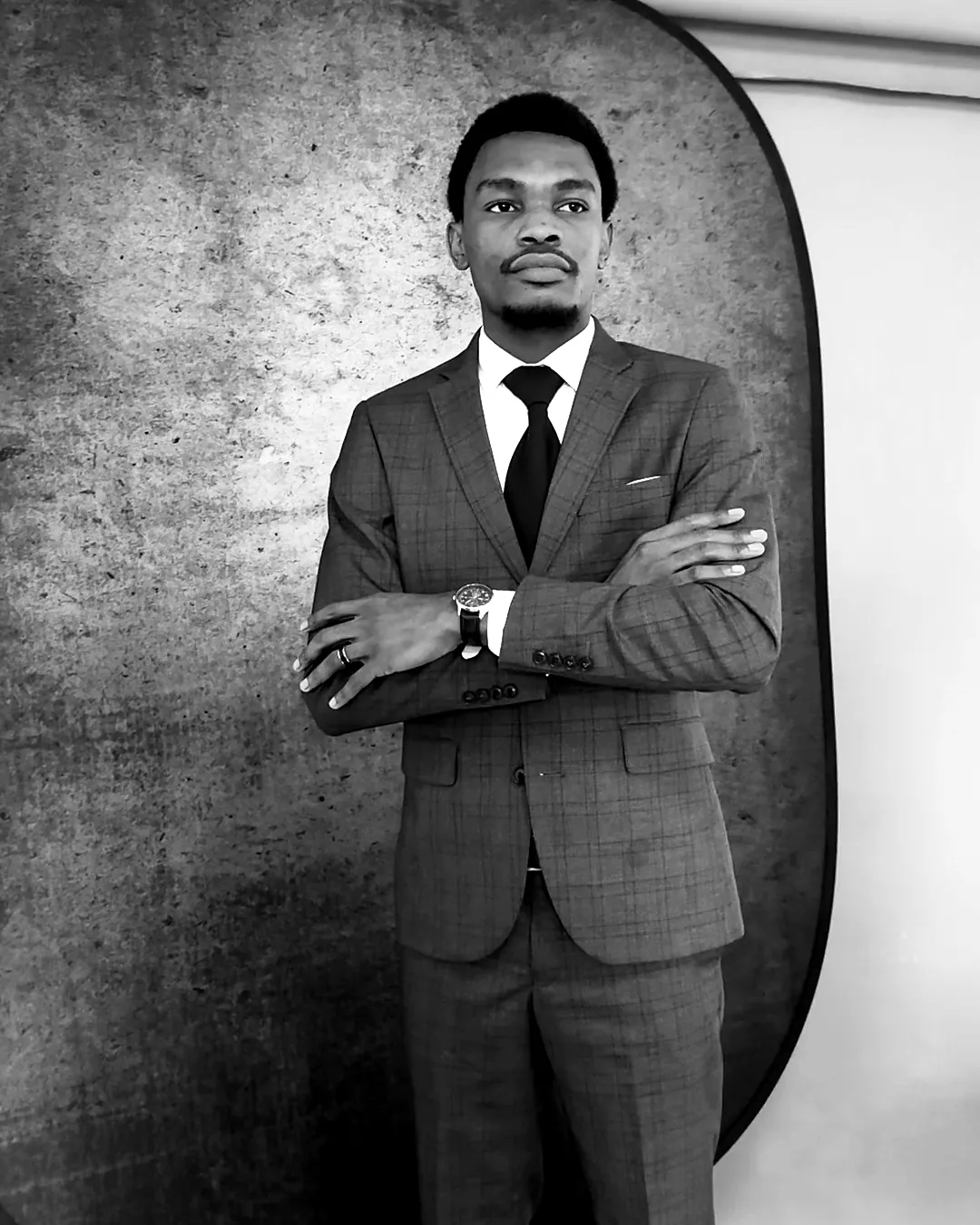 Portrait of Darryl Wassi in a suit